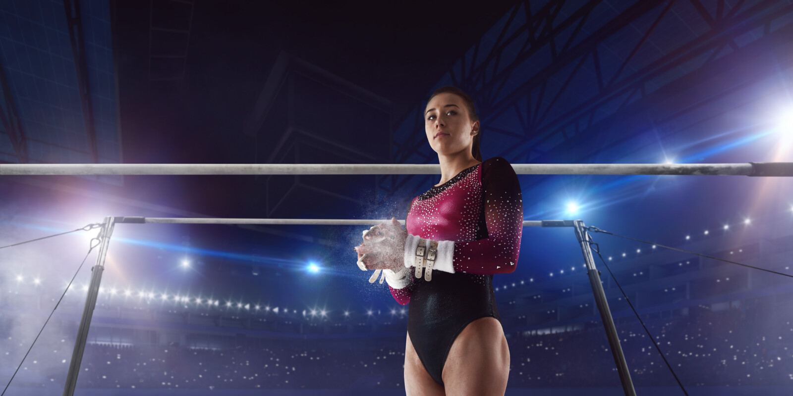 Female gymnast on professional arena.