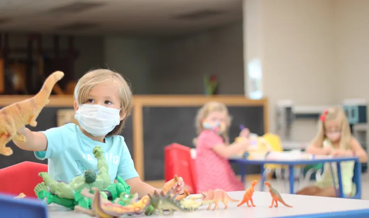 Pre-k with masks and dinsaur